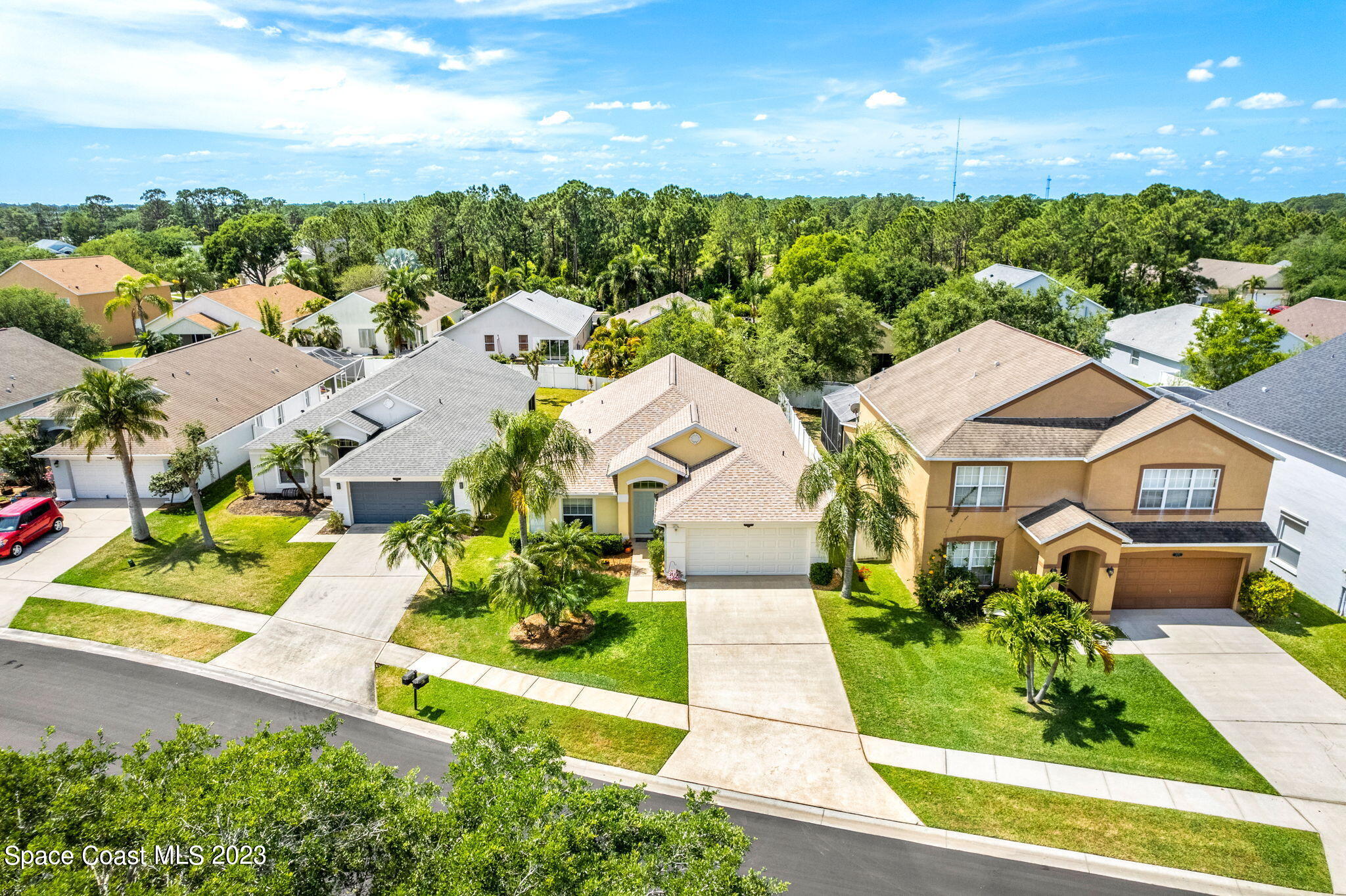 2463 Glasbern Circle Melbourne, FL 32904 - Photo 33 of 57 an aerial view of residential houses with outdoor space and street view