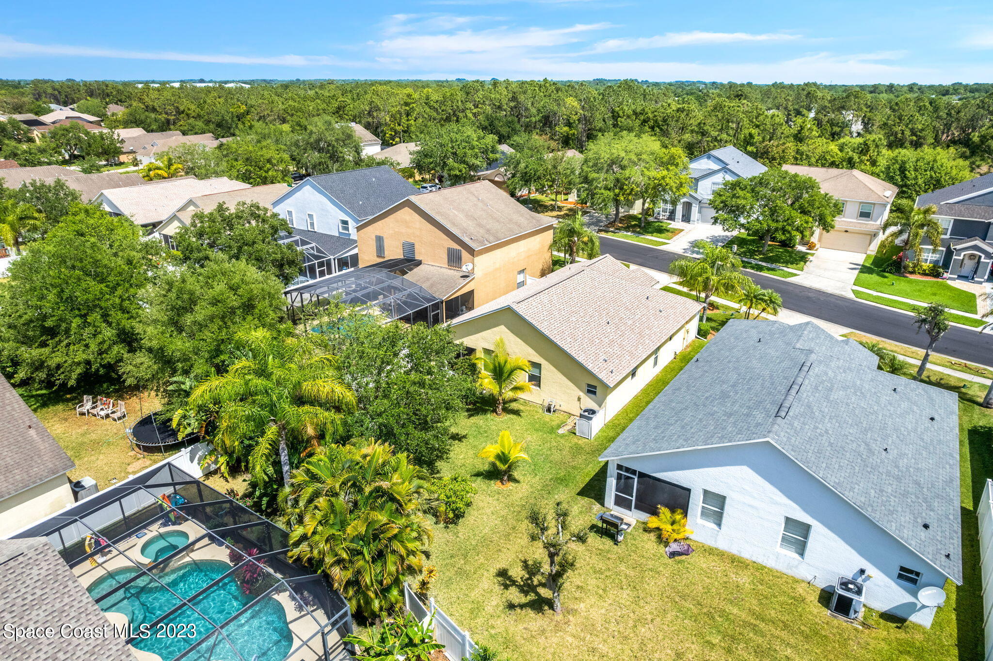 2463 Glasbern Circle Melbourne, FL 32904 - Photo 34 of 57 an aerial view of a house with a yard and lake view