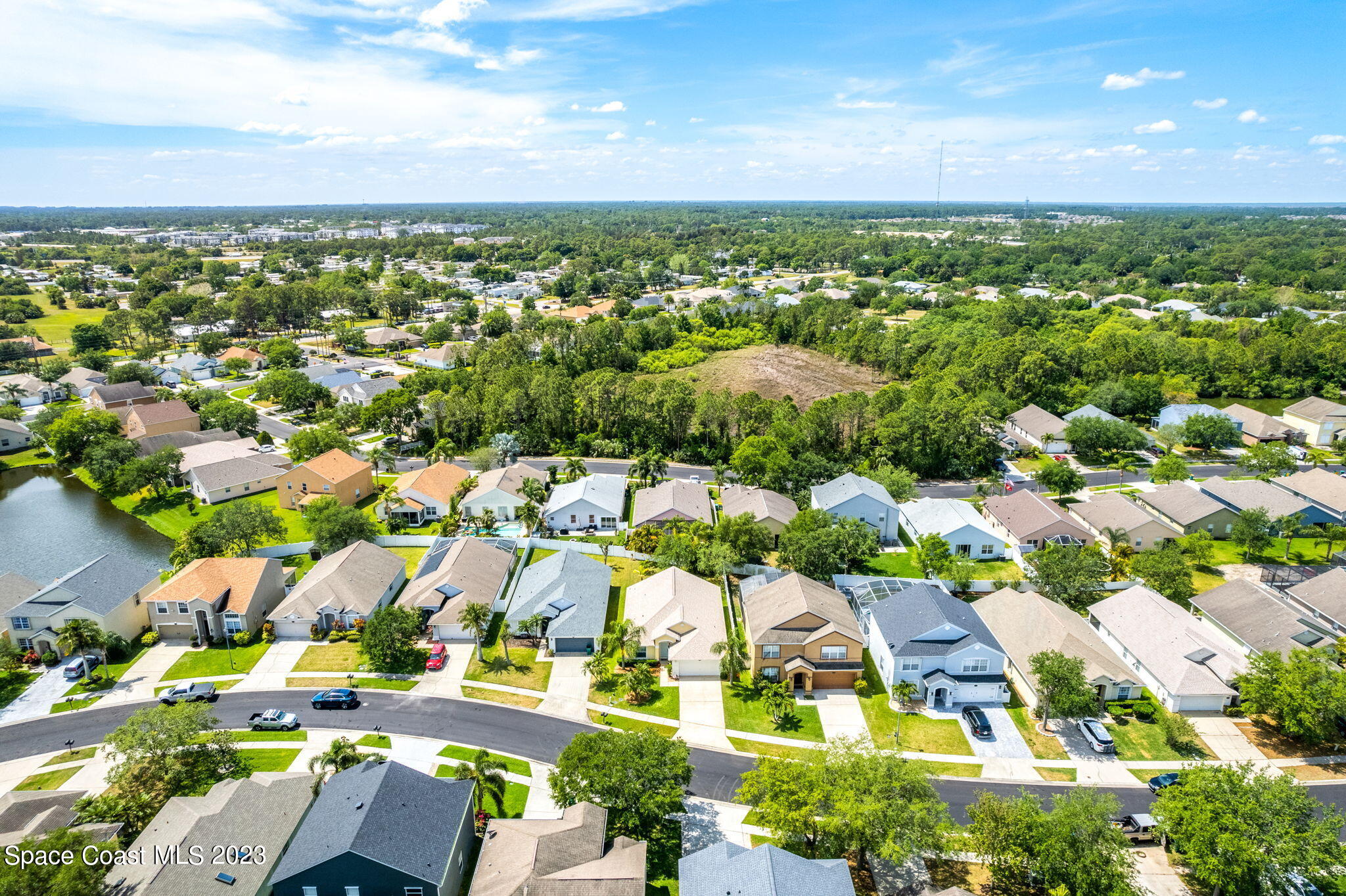 2463 Glasbern Circle Melbourne, FL 32904 - Photo 35 of 57 an aerial view of residential houses with outdoor space and swimming pool