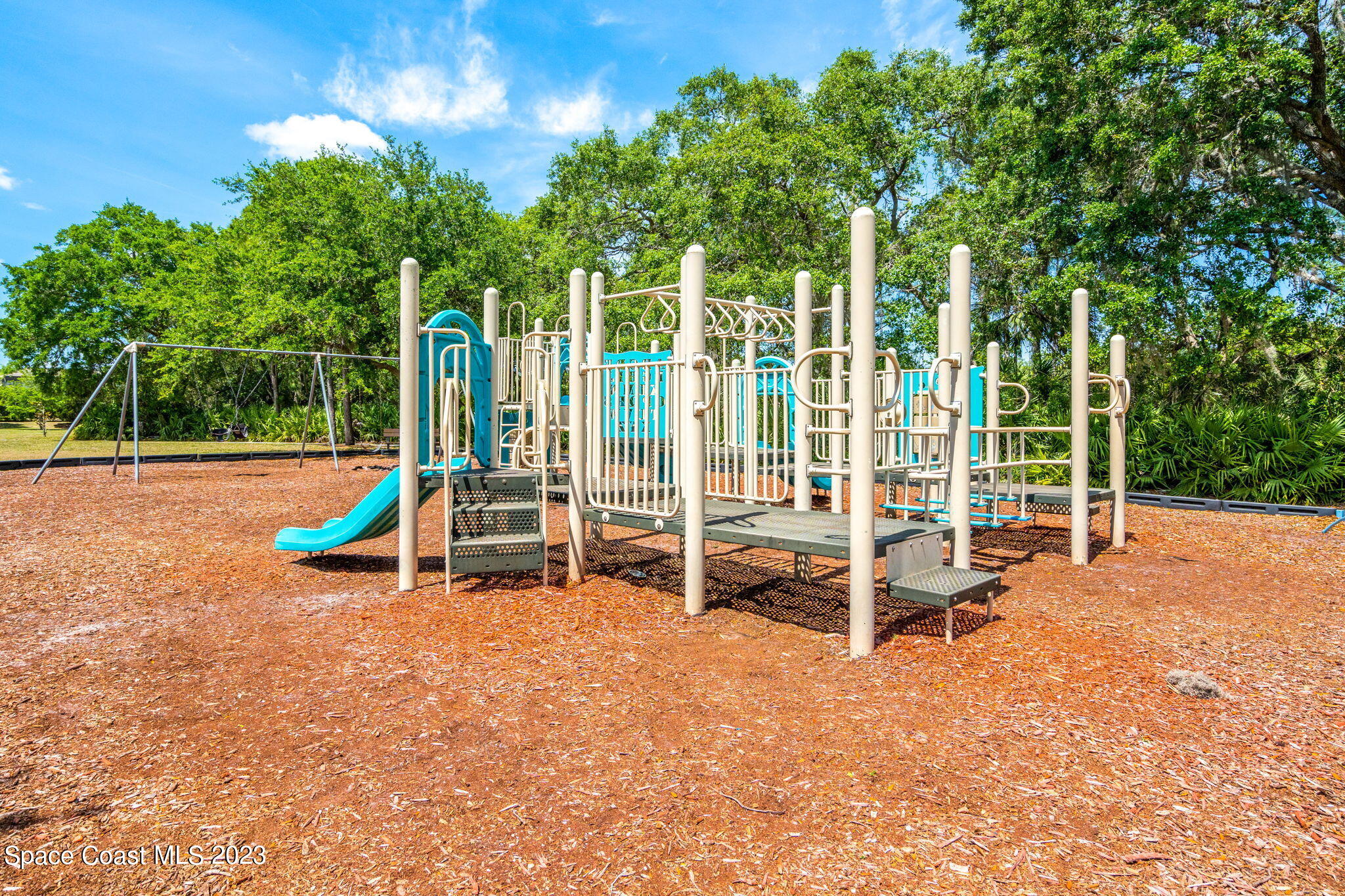 2463 Glasbern Circle Melbourne, FL 32904 - Photo 40 of 57 a view of a park with slide and bench