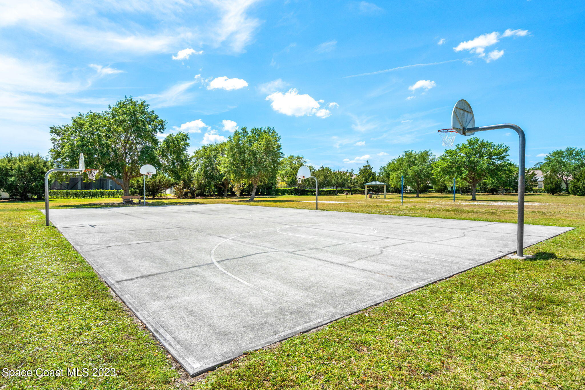 2463 Glasbern Circle Melbourne, FL 32904 - Photo 41 of 57 a view of a swimming pool with an outdoor space and seating area