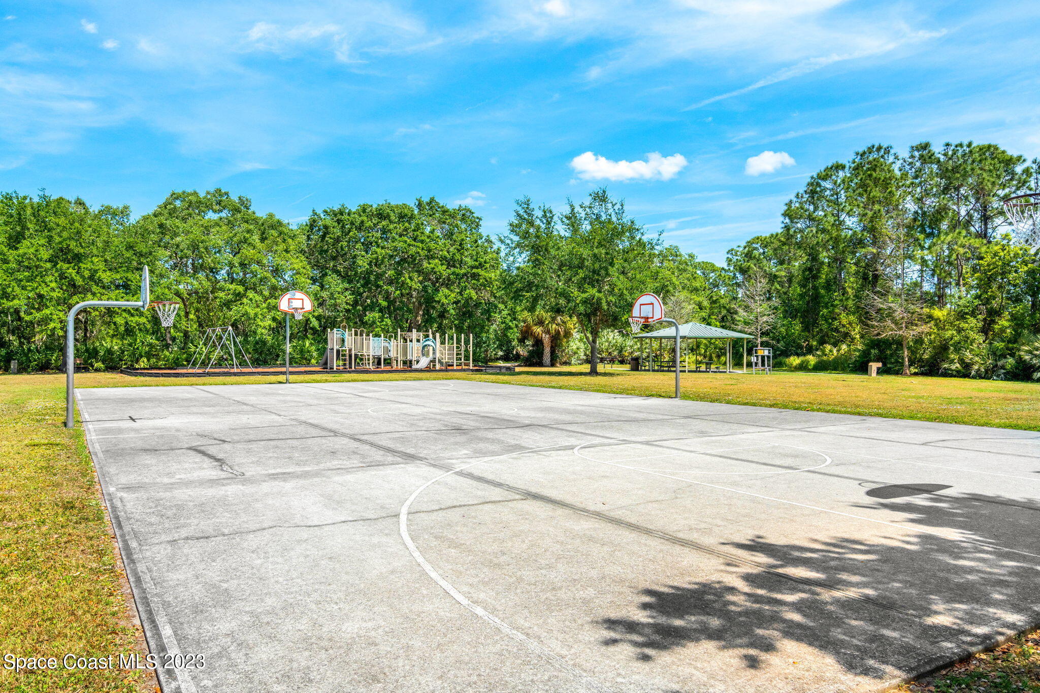 2463 Glasbern Circle Melbourne, FL 32904 - Photo 42 of 57 a view of swimming pool with an outdoor space and seating area