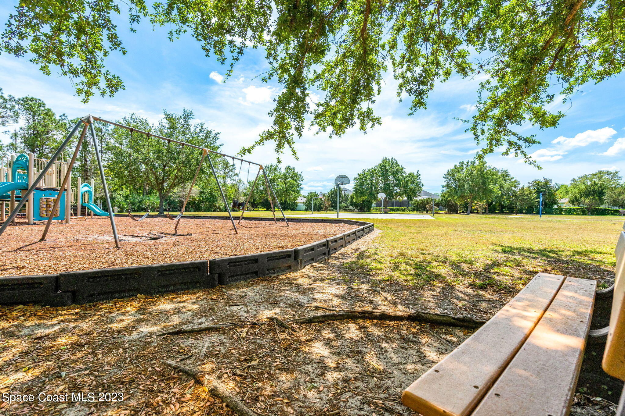 2463 Glasbern Circle Melbourne, FL 32904 - Photo 44 of 57 a view of a swimming pool with a lake view