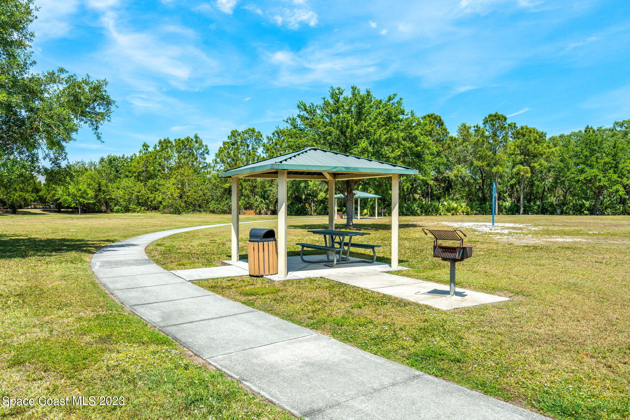 2463 Glasbern Circle Melbourne, FL 32904 - Photo 45 of 57 a view of a swimming pool with a patio