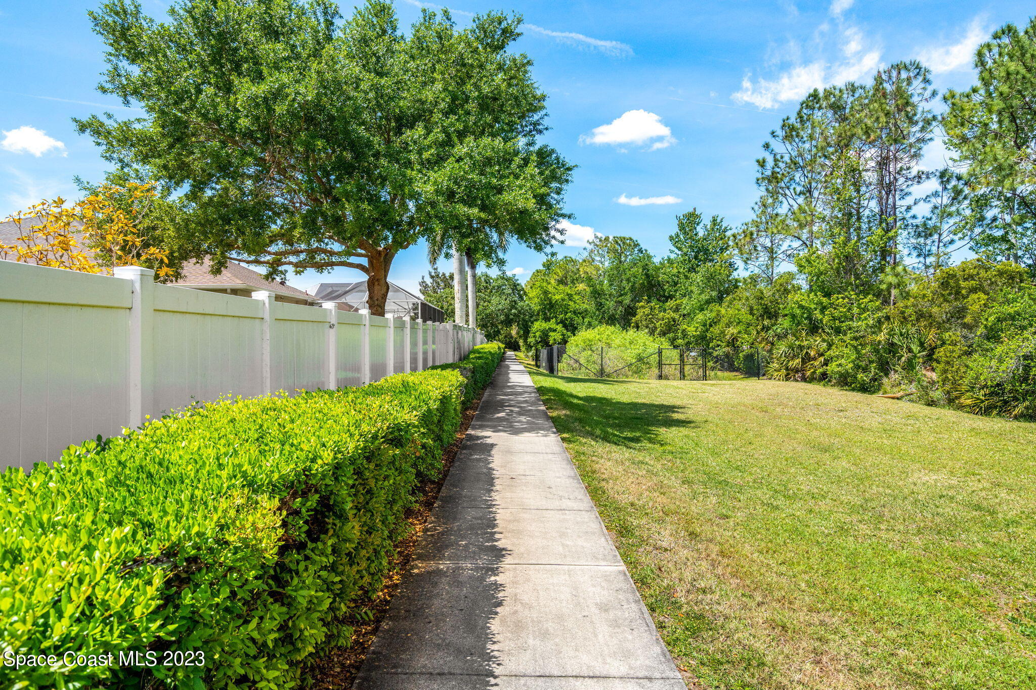 2463 Glasbern Circle Melbourne, FL 32904 - Photo 51 of 57 a view of a pathway with a yard