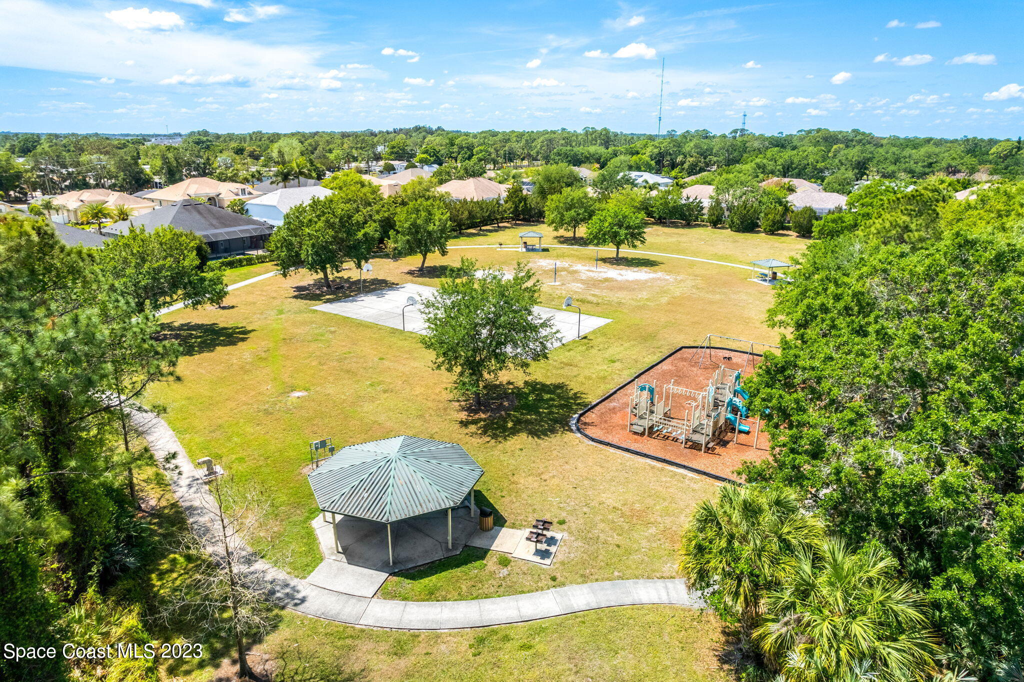 2463 Glasbern Circle Melbourne, FL 32904 - Photo 52 of 57 a view of a lake in middle of the town