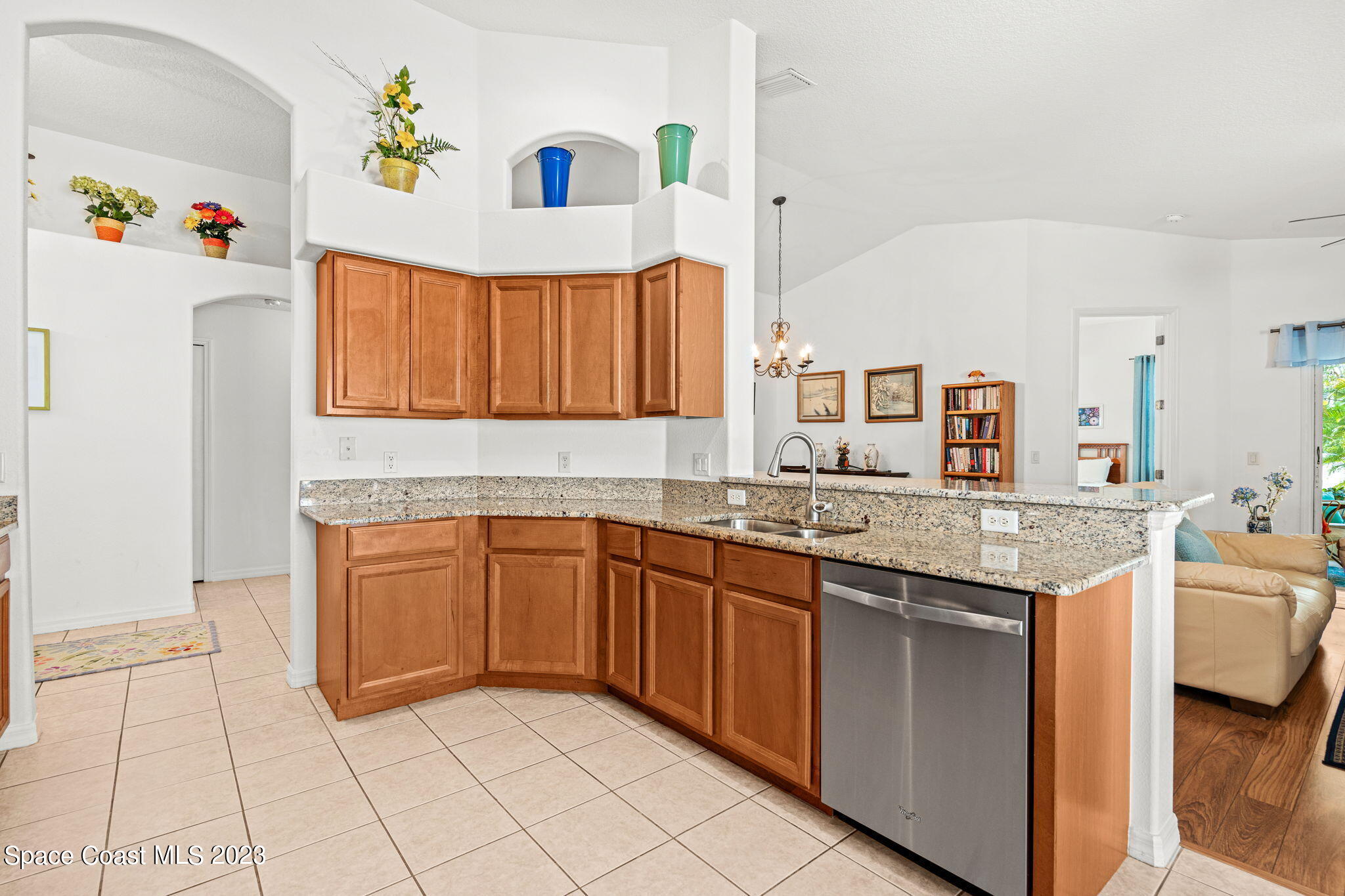 2463 Glasbern Circle Melbourne, FL 32904 - Photo 9 of 57 a kitchen with granite countertop a sink and a stove