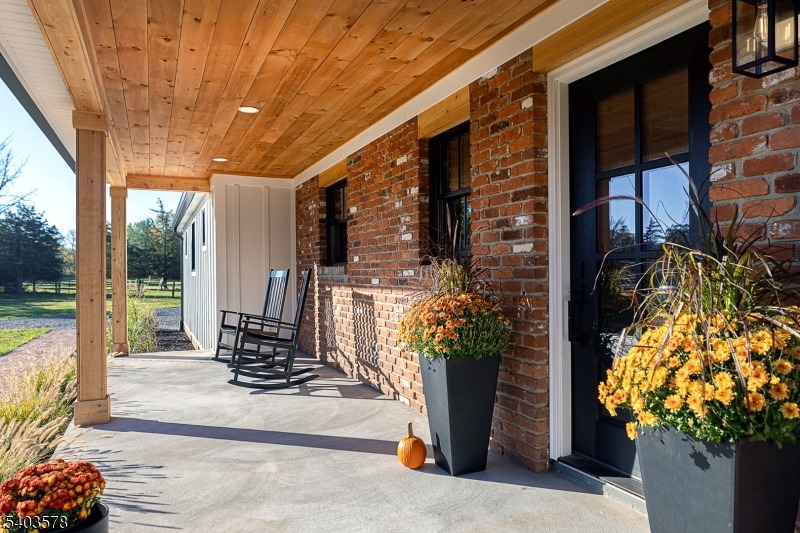 113 Cole Road Flemington, NJ 08822 - Photo 2 of 31 a building outdoor space with patio furniture and potted plants