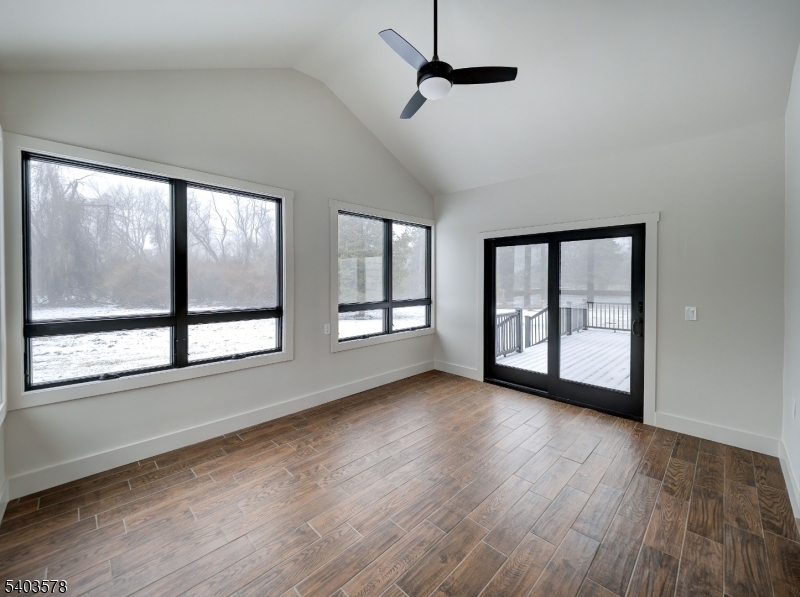113 Cole Road Flemington, NJ 08822 - Photo 8 of 31 a view of an empty room with wooden floor and a window
