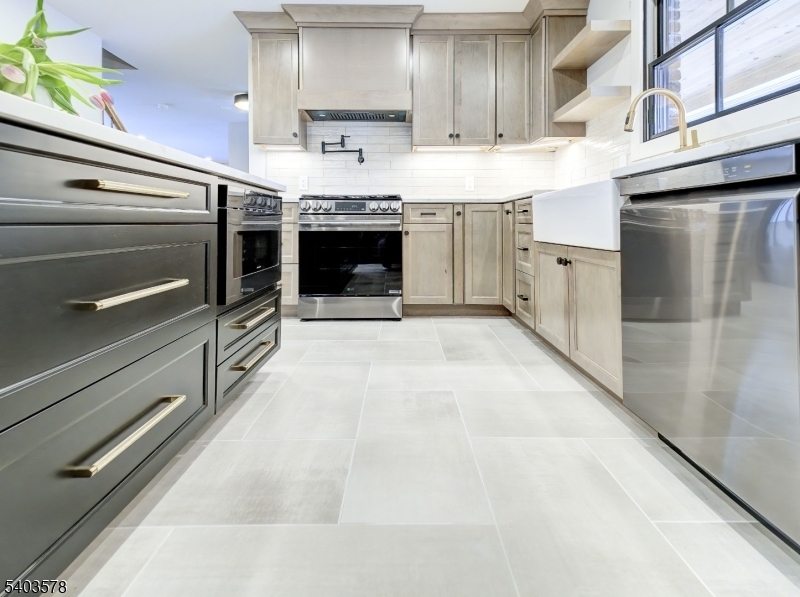 113 Cole Road Flemington, NJ 08822 - Photo 10 of 31 a kitchen with stainless steel appliances kitchen island granite countertop a stove and a sink