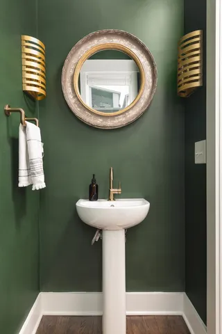 a bathroom with a sink and mirror