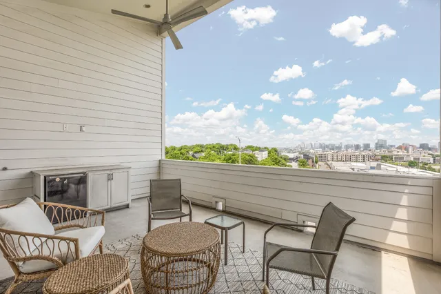 a view of a terrace with furniture and a potted plant