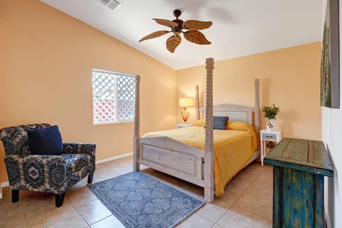 a bedroom with a bed and a couch