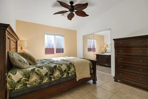 a bedroom with a bed and dresser