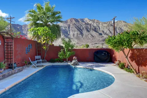 a view of a chairs and table in the patio