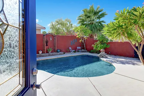 a view of a backyard with potted plants