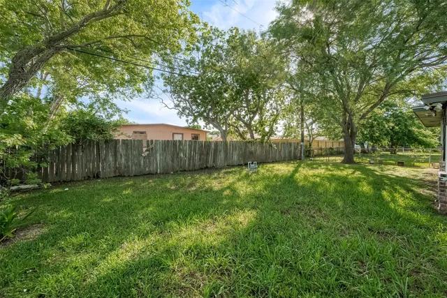 a view of outdoor space with deck and yard