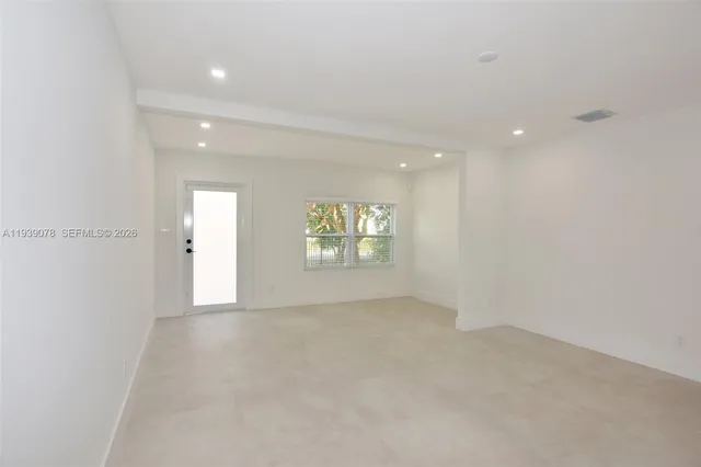 en empty room with windows