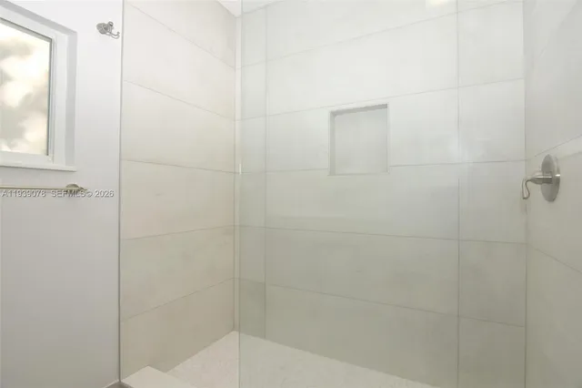 a bathroom with a sink vanity and a mirror