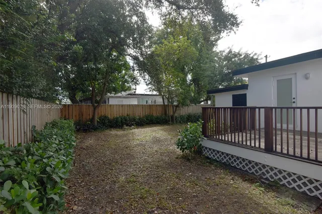 a balcony with trees in front of it