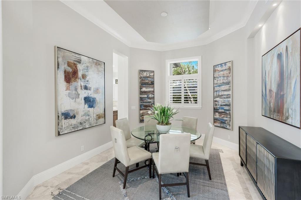 14459 Marsala Way Naples, FL 34109 - Photo 15 of 50 a view of a dining room with furniture window and wooden floor