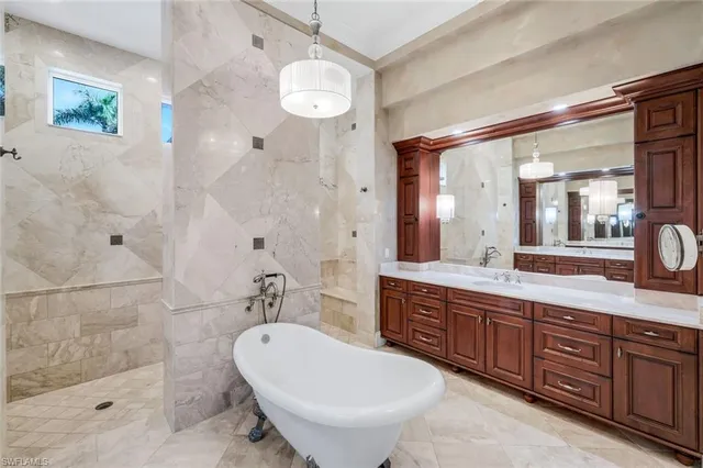 a bathroom with a double vanity sink mirror and toilet