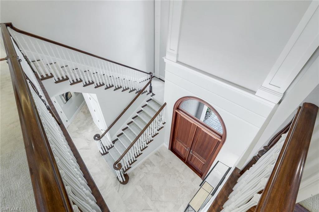 14459 Marsala Way Naples, FL 34109 - Photo 27 of 50 a view of staircase with white walls and a window
