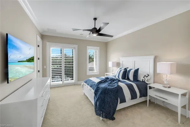 a spacious bedroom with a bed and a large window