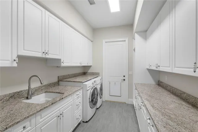 a kitchen that has a sink and a stove