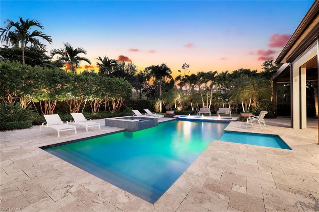 14459 Marsala Way Naples, FL 34109 - Photo 40 of 50 a view of a swimming pool with lounge chairs
