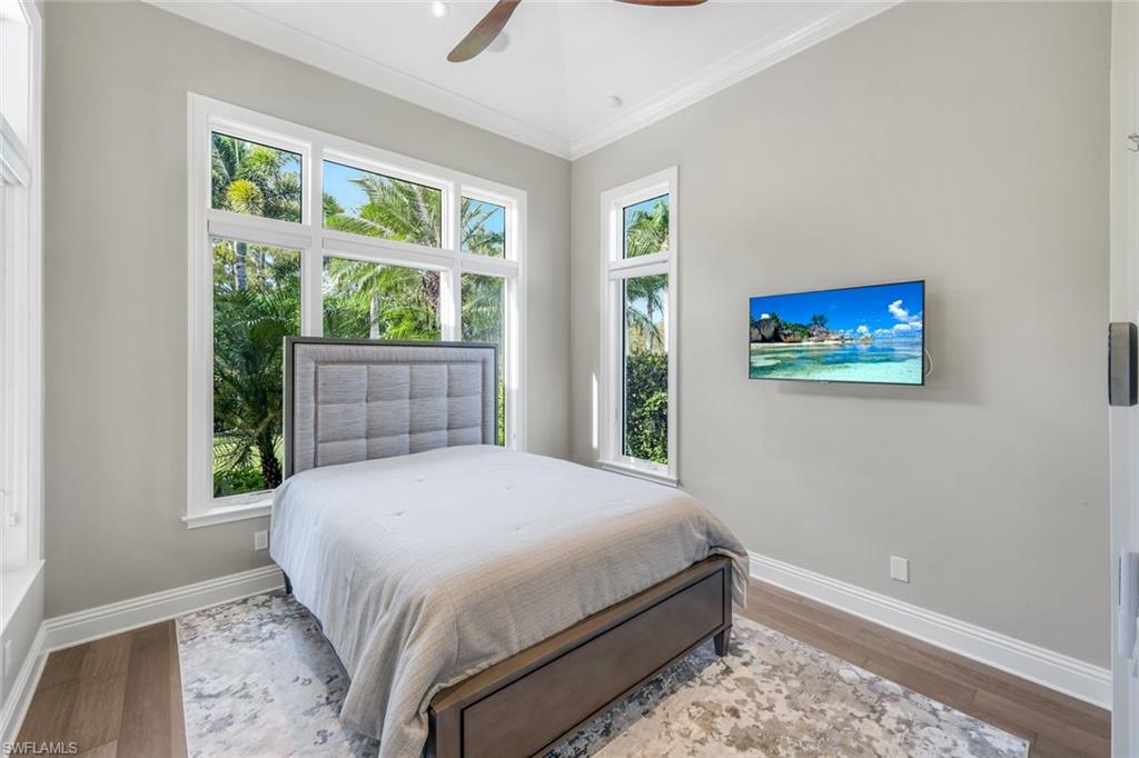 14459 Marsala Way Naples, FL 34109 - Photo 43 of 50 a bedroom with a bed and a window