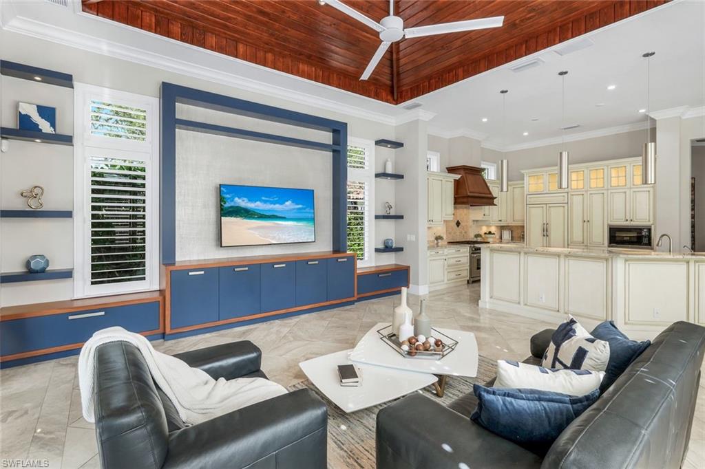 14459 Marsala Way Naples, FL 34109 - Photo 8 of 50 a living room with furniture kitchen view and a window