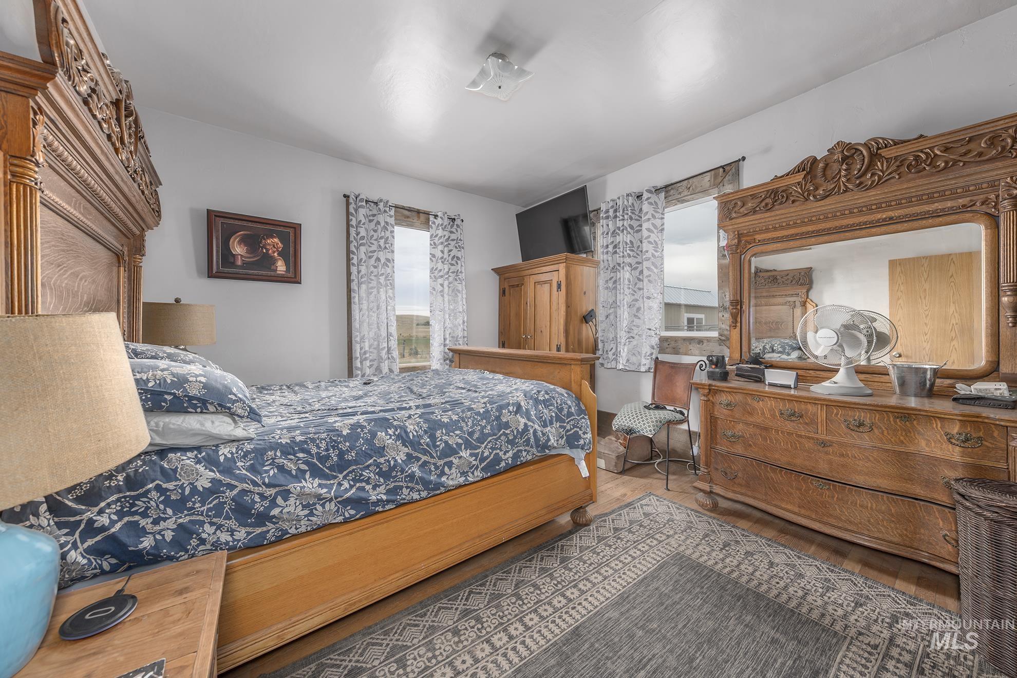 724 Mundy Gulch Road Indian Valley, ID 83632 - Photo 14 of 43 Bedroom with wood finished floors