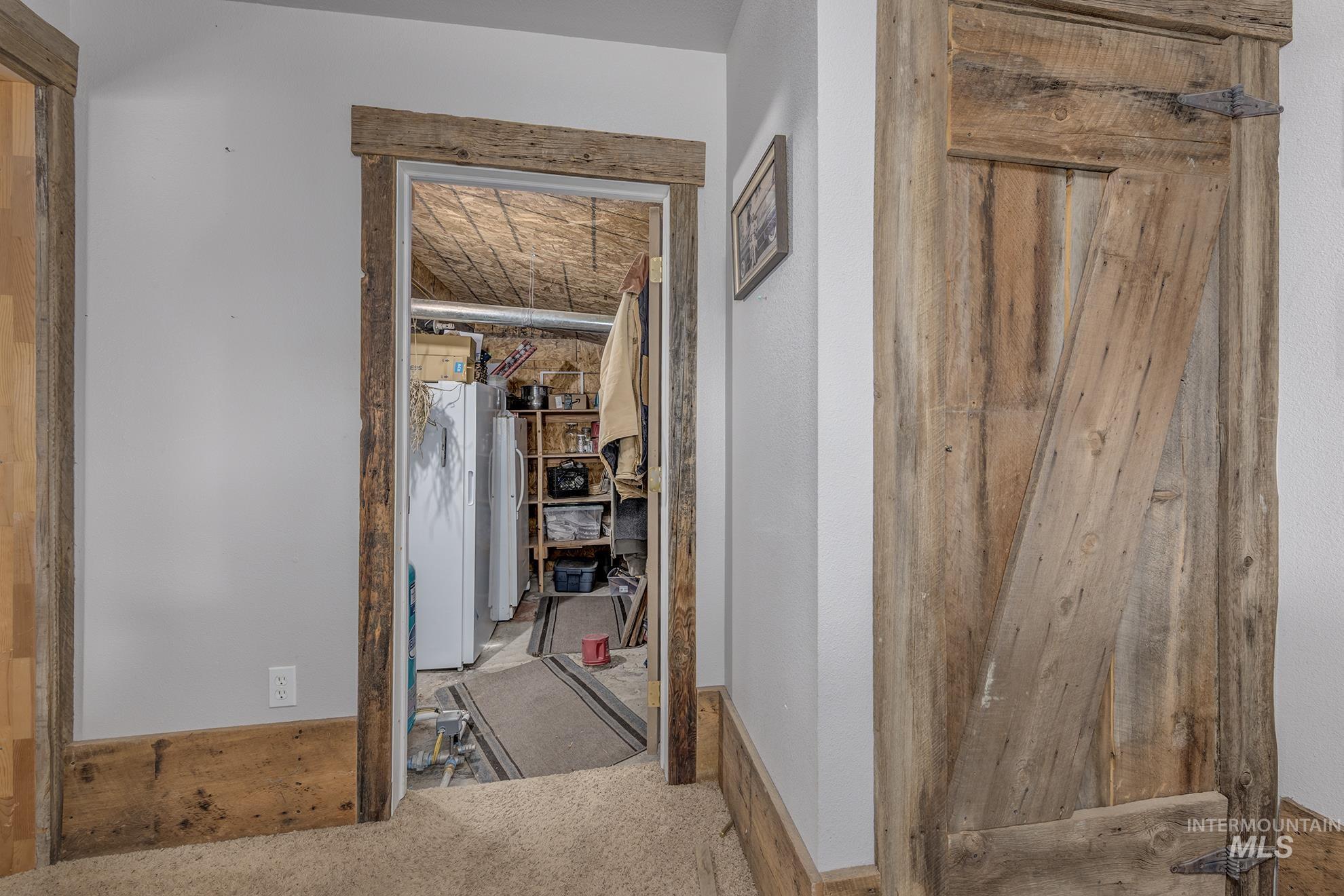 724 Mundy Gulch Road Indian Valley, ID 83632 - Photo 20 of 43 Corridor with carpet flooring and baseboards
