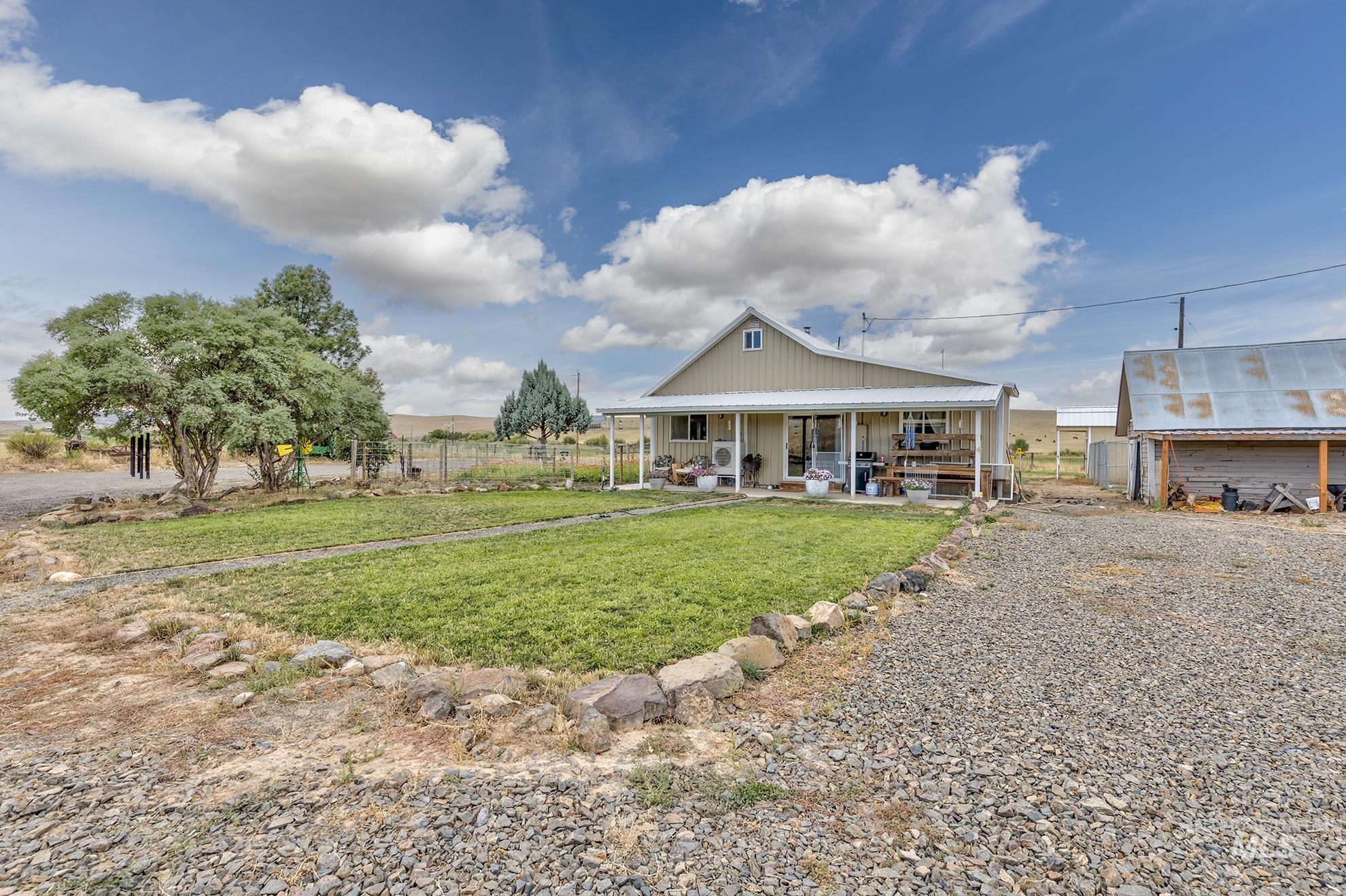 724 Mundy Gulch Road Indian Valley, ID 83632 - Photo 24 of 43 View of front of house featuring covered porch and board and batten siding