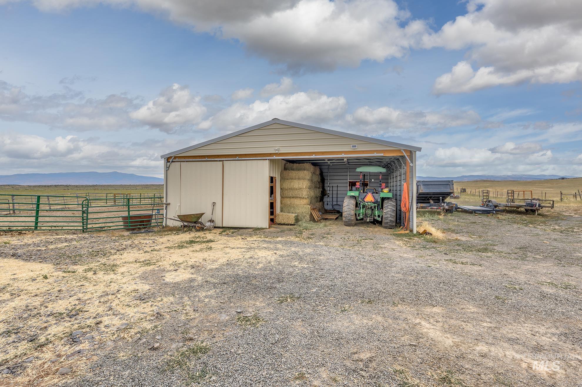 724 Mundy Gulch Road Indian Valley, ID 83632 - Photo 26 of 43 View of pole building featuring a mountain view and a view of rural / pastoral area