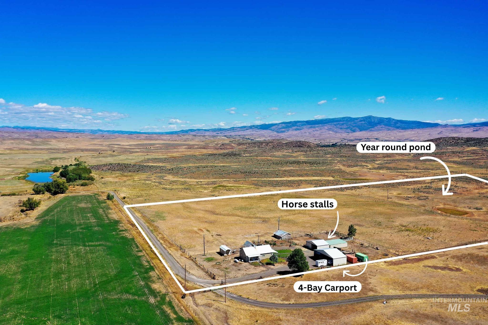 724 Mundy Gulch Road Indian Valley, ID 83632 - Photo 3 of 43 View of rural area with property boundaries highlighted and mountains