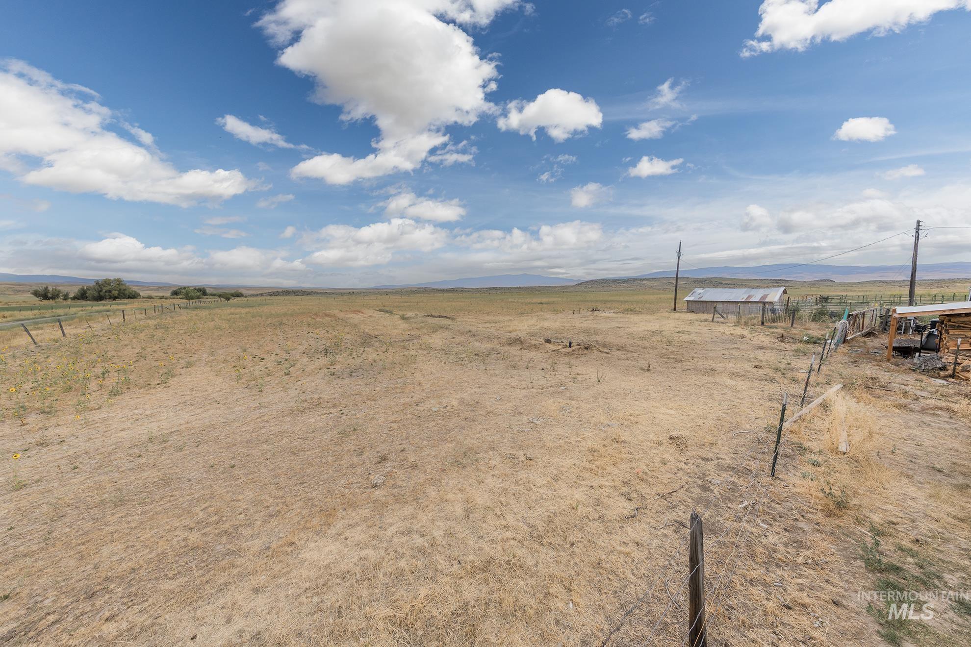 724 Mundy Gulch Road Indian Valley, ID 83632 - Photo 37 of 43 View of yard featuring a view of rural / pastoral area and a mountain view