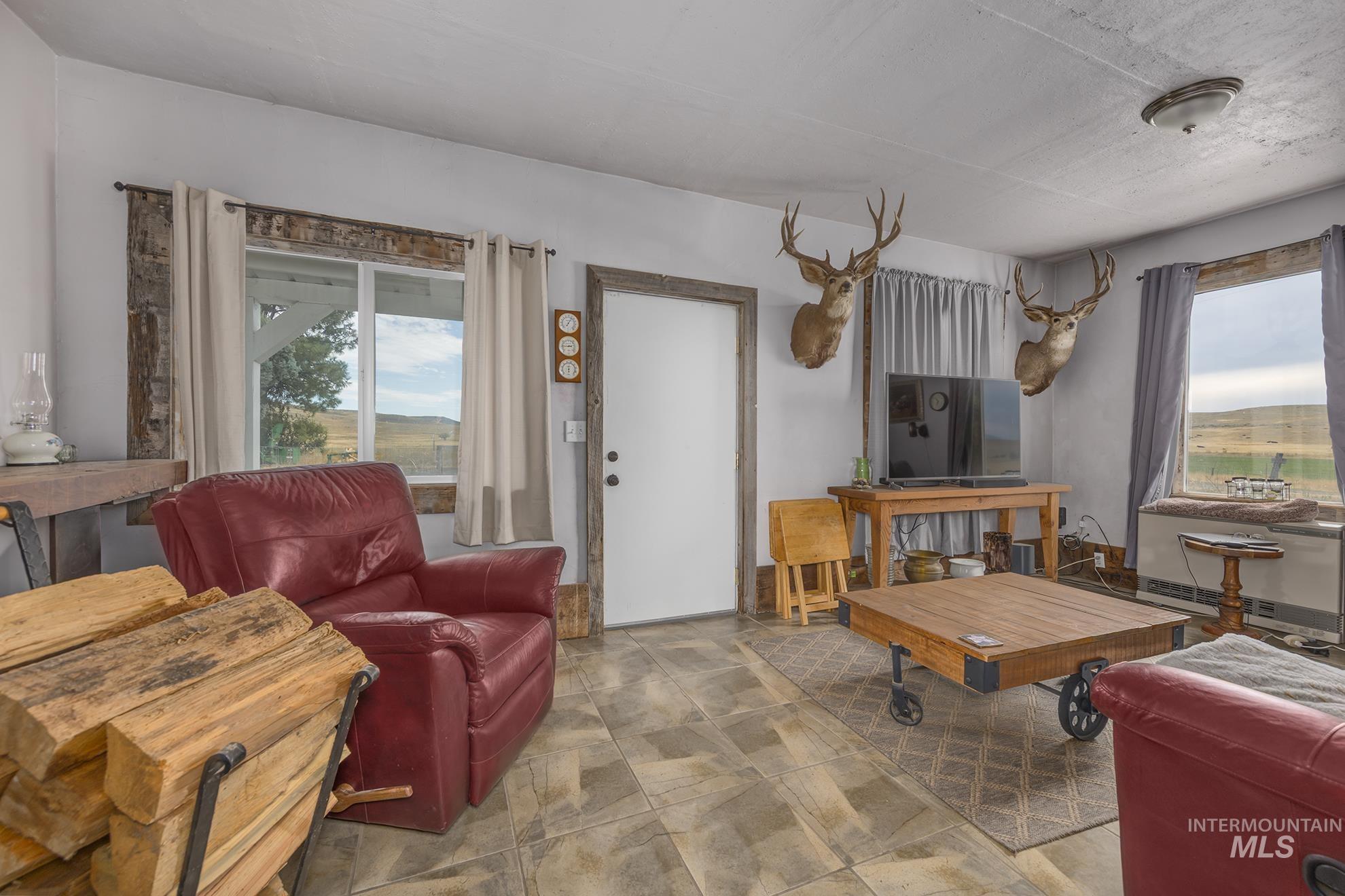 724 Mundy Gulch Road Indian Valley, ID 83632 - Photo 5 of 43 Living room with stone finish flooring