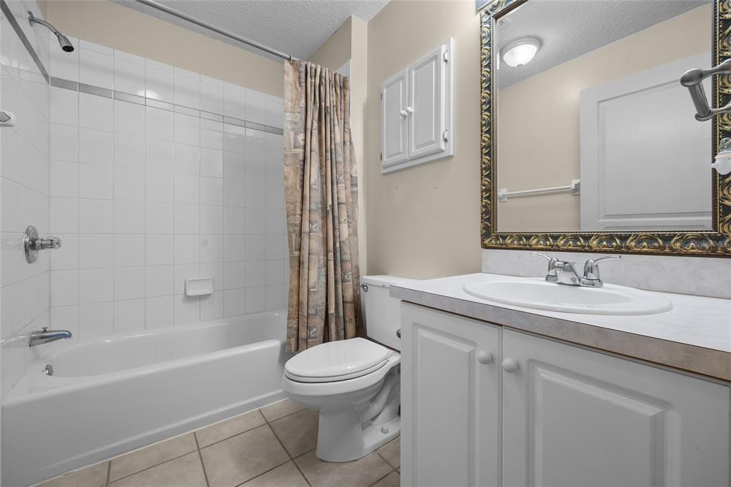 3951 Myrtle Street St. Augustine, FL 32084 - Photo 12 of 23 a bathroom with a sink a toilet and a mirror