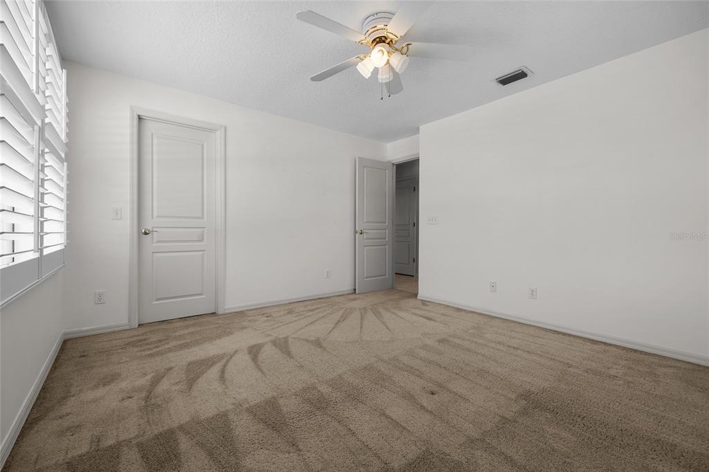 3951 Myrtle Street St. Augustine, FL 32084 - Photo 14 of 23 wooden floor in an empty room with a window