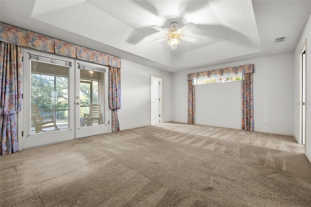 3951 Myrtle Street St. Augustine, FL 32084 - Photo 15 of 23 a view of an empty room with chandelier fan and windows