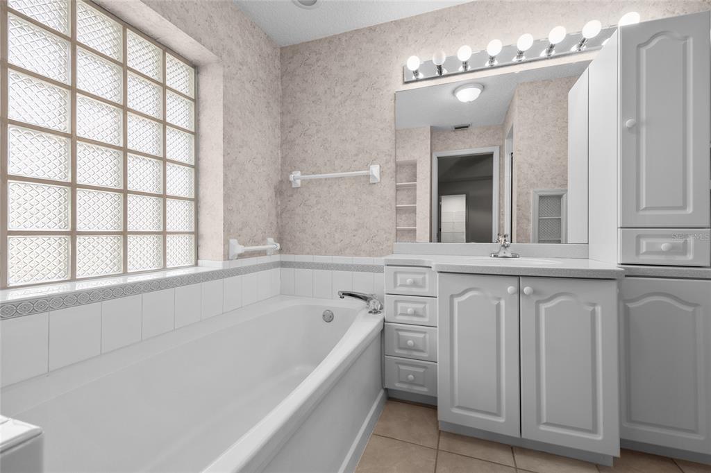 3951 Myrtle Street St. Augustine, FL 32084 - Photo 17 of 23 a bathroom with a tub sink and mirror