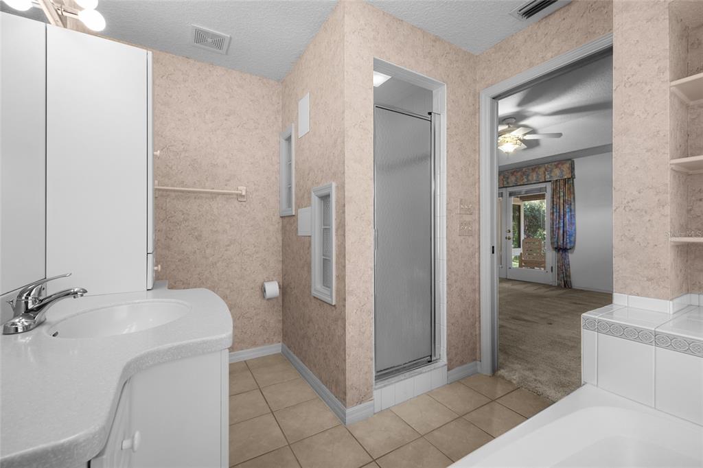 3951 Myrtle Street St. Augustine, FL 32084 - Photo 18 of 23 a bathroom with a sink and mirror