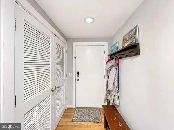 a view of hallway with a door and a window