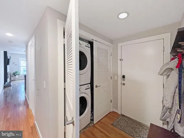 a view of a hallway with washer and dryer