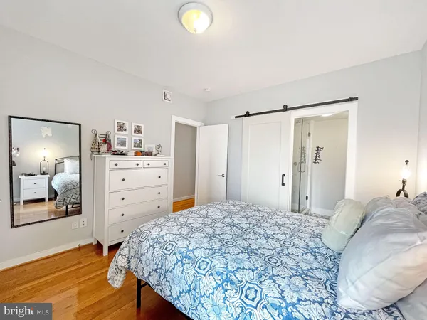 a bedroom with a bed and a cabinets