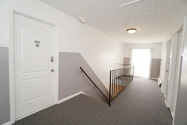 a view of a hallway with staircase