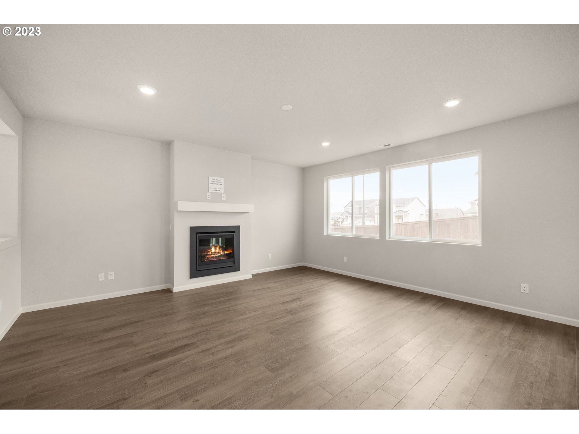 6072 Southeast 24th Street Gresham, OR 97080 - Photo 4 of 37 a view of an empty room with wooden floor and a window