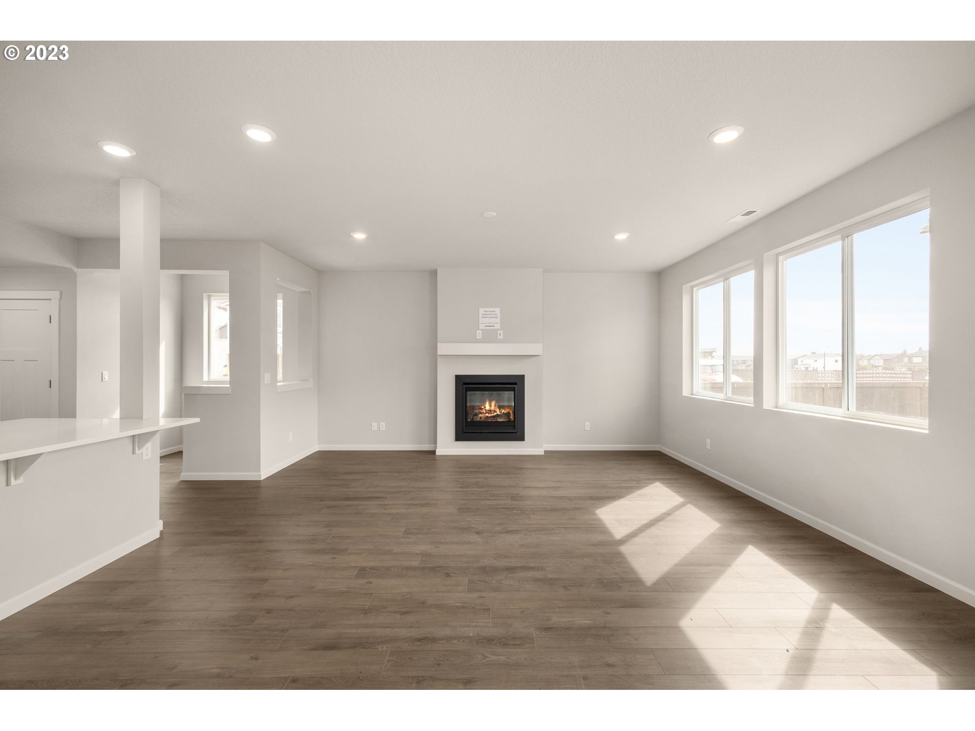 6072 Southeast 24th Street Gresham, OR 97080 - Photo 6 of 37 a view of an empty room with a window and fireplace